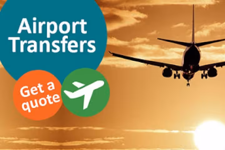 Airport transfers banner with airplane at sunset promoting private 8 pax Chania Airport to Rethymno taxi service