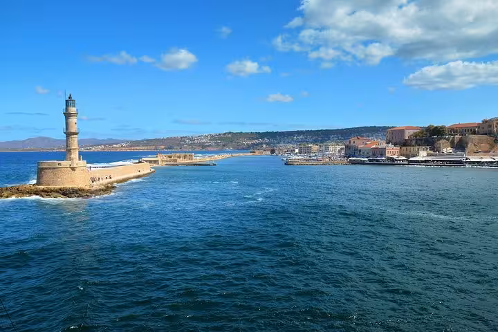 Chania Old Venetian Harbor lighthouse view, scenic start of private day trip to Elafonissi Beach from Chania