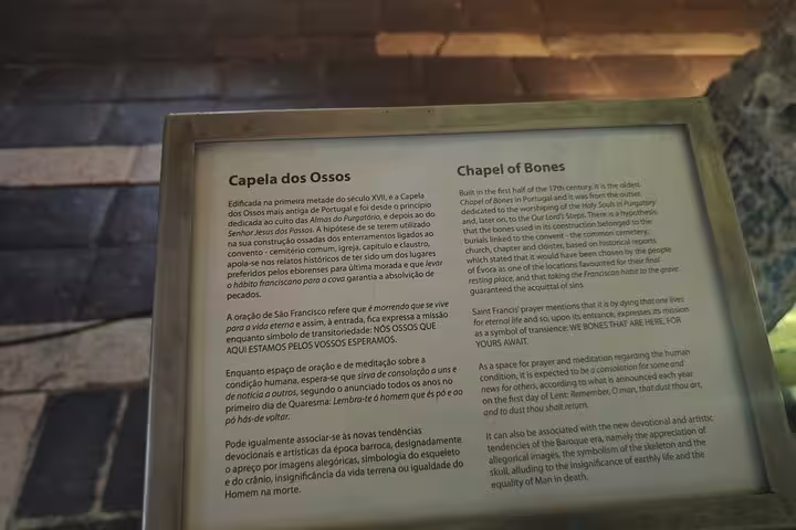Sign detailing history and significance of Chapel of Bones in Évora, a UNESCO site on the Lisbon to Monsaraz tour.