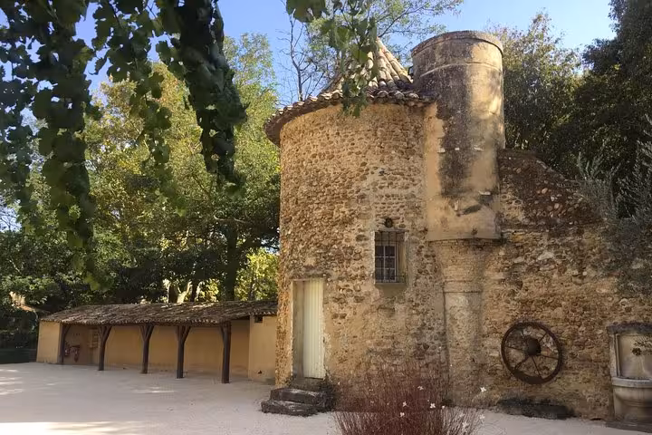 Historic stone winery building in Provence, a stop on the Châteauneuf-du-Pape wine tour from Avignon
