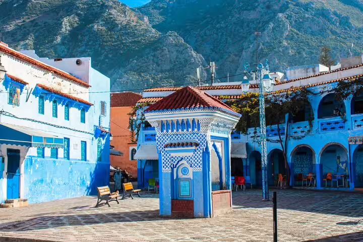 Chefchaouen main square with blue buildings and Rif Mountains backdrop on 2-day Casablanca to Chefchaouen trip