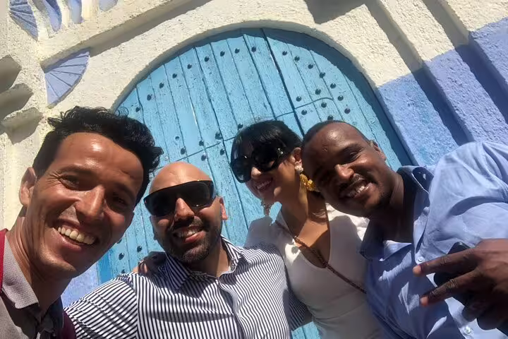 Friends selfie at Chefchaouen blue door on 2-day trip from Casablanca, Morocco Blue City tour highlight