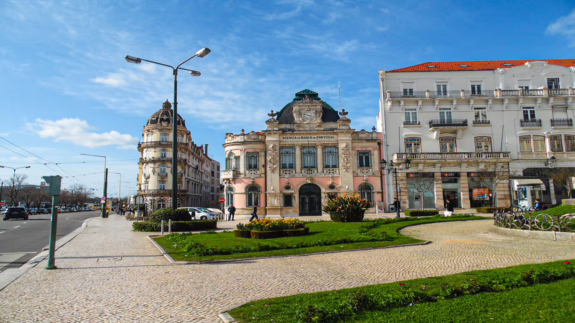 Street view of historical architecture in Coimbra, Portugal, showcasing classic European design on a sunny day.