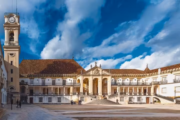 Visit the University of Coimbra's grand courtyard and clock tower on a private walking tour, a UNESCO World Heritage site.