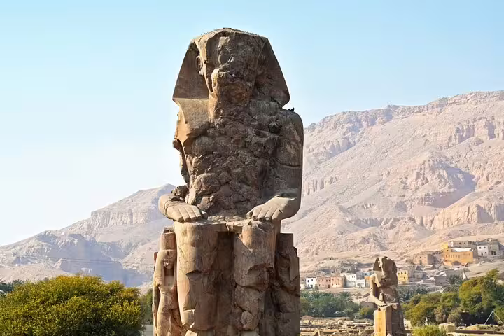 Colossal Memnon statue at Luxor on a private full-day tour from Aswan by car, Egypt Nile Valley views