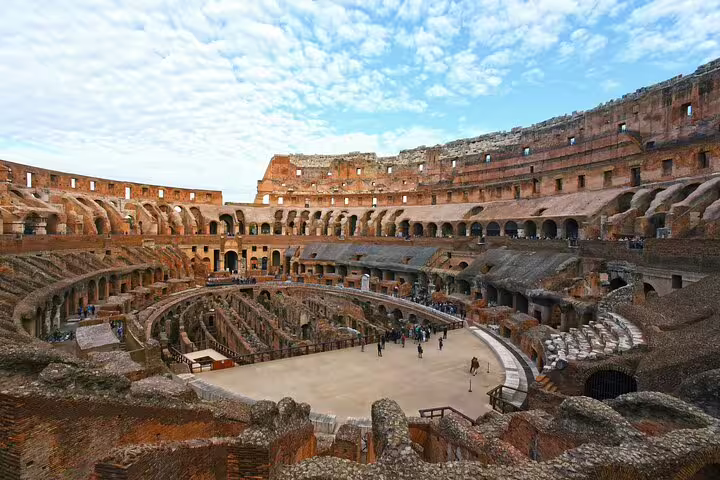 Colosseum inside panorama showing arena floor and underground chambers, included with Roman Forum pass