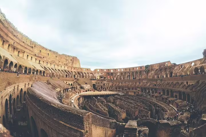 Interior view of the Colosseum arena and hypogeum ruins with entrance pass access in Rome, Italy