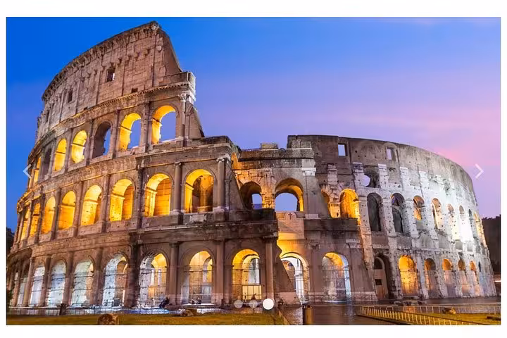Colosseum glowing under twilight skies, highlighting ancient Roman architecture on a guided night tour in Rome.