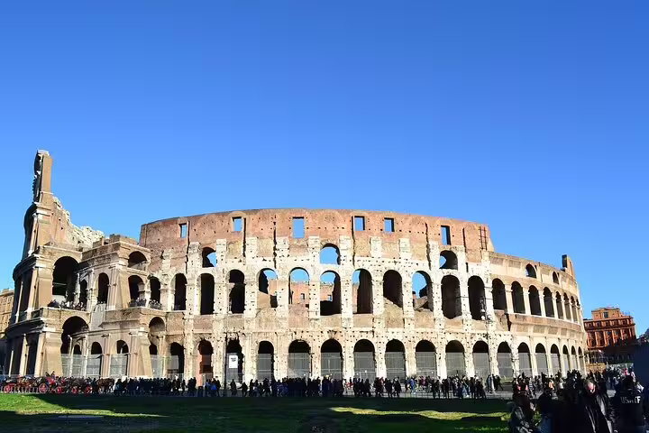Crowds outside the ancient Colosseum in Rome on a skip-the-line small-group tour with expert local guide