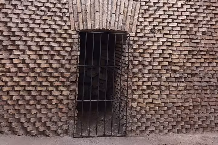 Entrance to the underground chambers of the Colosseum, revealing the historic architecture on a guided night tour.
