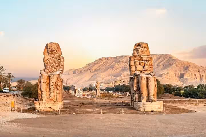 Colossi of Memnon at sunrise in Luxor, Egypt on private overnight Luxor trip from Hurghada with balloon