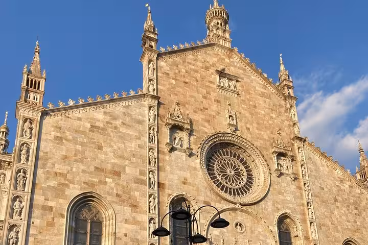 Como Cathedral façade in historic center, a highlight on Milan to Como Bellagio and Lugano Royal Cruise tour