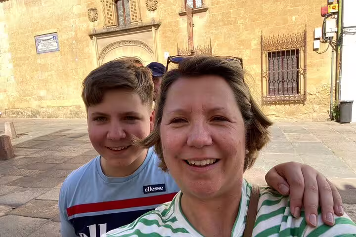 Travelers selfie in historic Cordoba square on scavenger hunt and city highlights walking tour in Spain