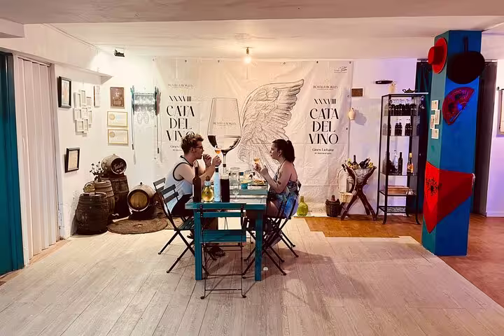 Charming venue setup for Cordoba sunset wine and cheese tasting experience with local delicacies.