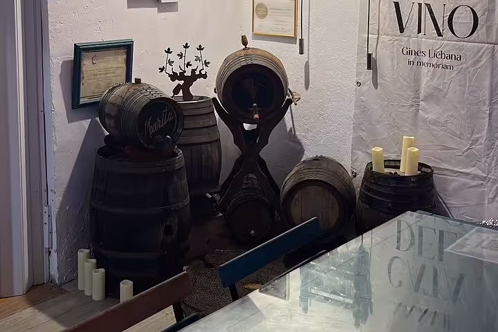 Rustic wine barrels in a cozy tasting room for Cordoba wine and cheese tour, highlighting local wine heritage.