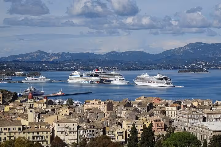 Corfu Old Town rooftops and cruise ships in the bay, coastal views on Corfu Beauty & the Beach private tour