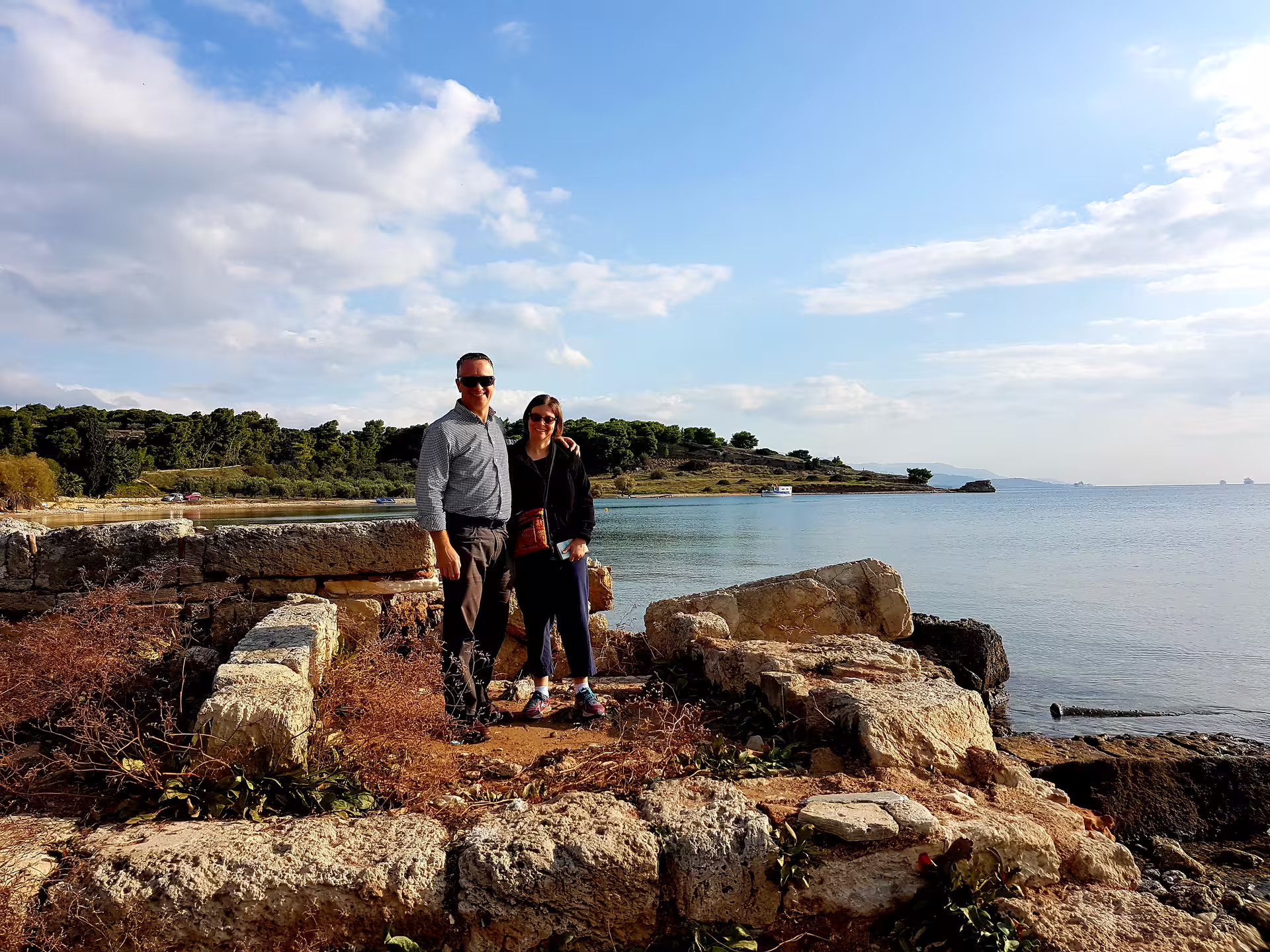 Couple by the Corinthian Gulf near Ancient Corinth, scenic stop on private biblical tour from Athens