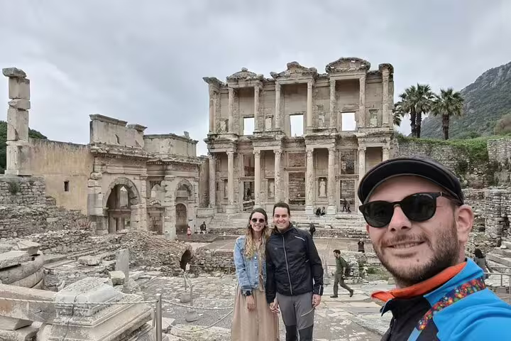 Couple selfie at Ephesus Library of Celsus on private Kusadasi Port shore excursion with shopping tour