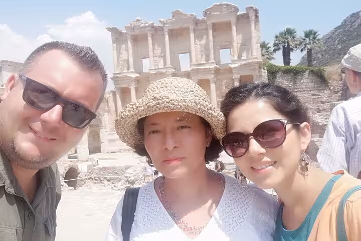Couple selfie at Ephesus with Library of Celsus backdrop on private skip-the-line tour for cruisers