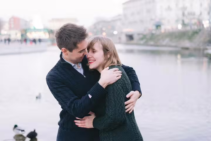 Romantic couple hug by Milan canal, photographed on a private personal travel photographer tour in the city