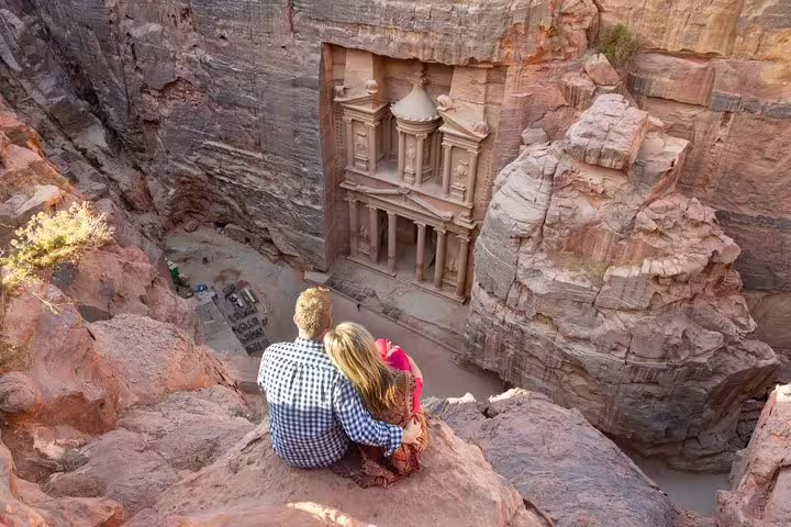 Couple overlooking Petra Treasury from viewpoint on Petra tour from Sharm by cruise, Jordan shore excursion