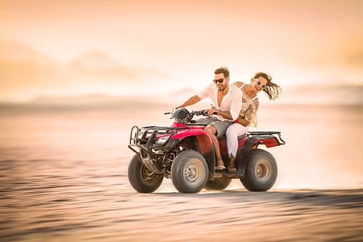 Couple speeding on a quad bike in the Sinai Desert, Double ATV Quad Safari Adventure from Sharm El Sheikh