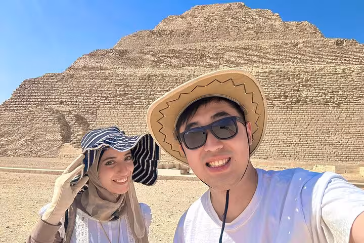 Couple selfie at Saqqara Step Pyramid on Dahshur and Memphis day trip from Cairo with 10% to stray dogs and cats