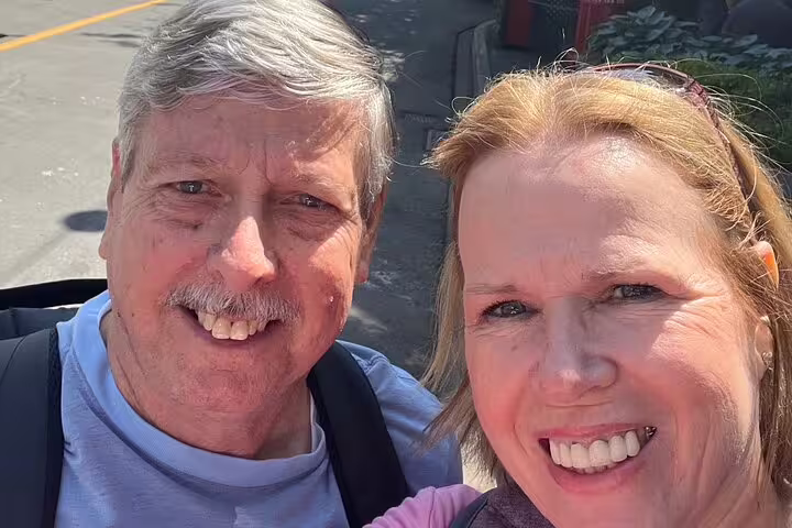 Happy couple selfie during Victoria scavenger hunt walking tour, exploring downtown landmarks and hidden gems