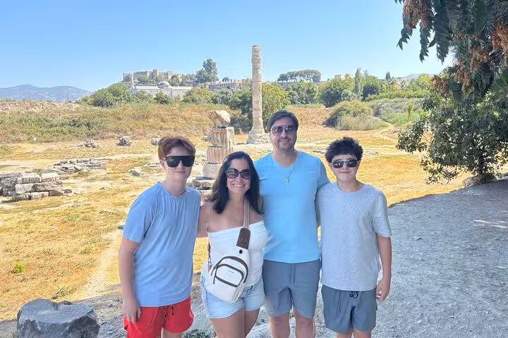 Cruise guests posing at ancient Ephesus ruins on a private no-shopping tour from Kusadasi port, Turkey