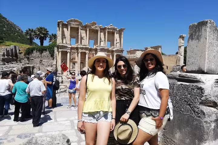 Cruise passengers posing at Ephesus ruins near the Library of Celsus on a private Ephesus tour with tickets