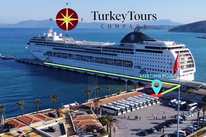 Cruise ship docked at Kusadasi port with marked meeting point for Ephesus Ancient City tour departure.