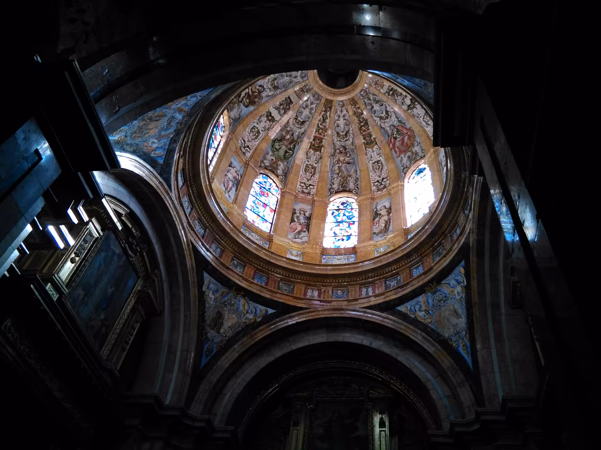 Painted dome and stained-glass windows inside Cuenca Cathedral, included on Madrid to Cuenca excursion