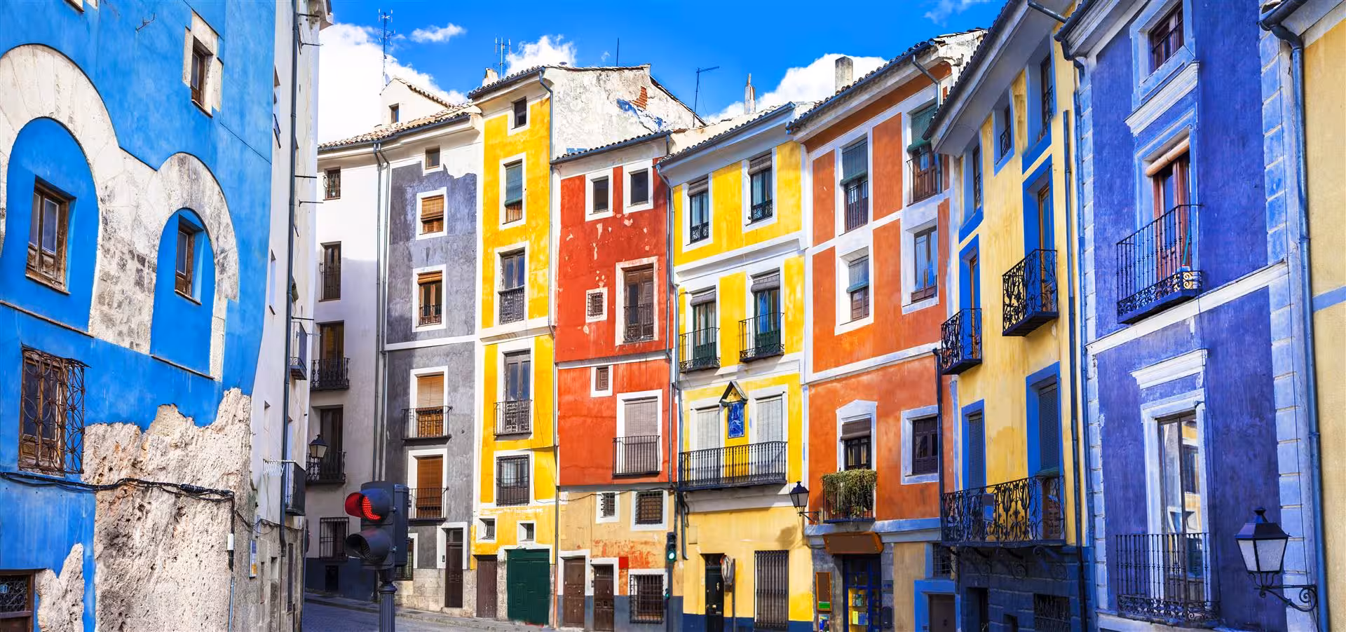 Colorful facades in Cuenca old town on a day trip from Madrid, near the Hanging Houses viewpoint