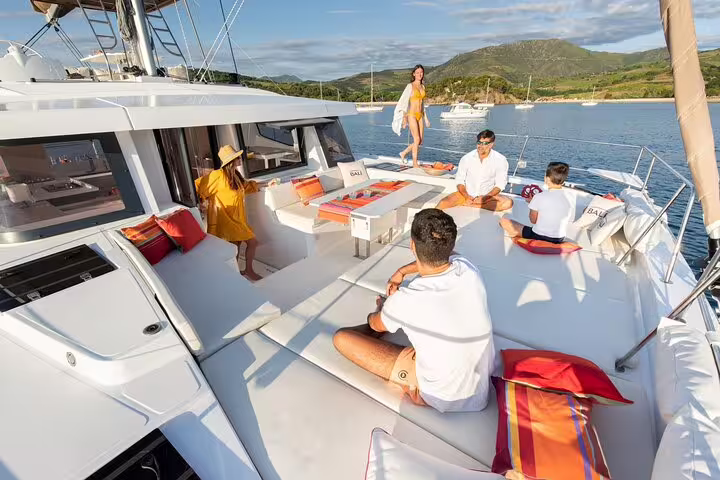 Group enjoying a luxurious catamaran tour from Limassol, Cyprus, with stunning coastal views and elegant onboard seating.