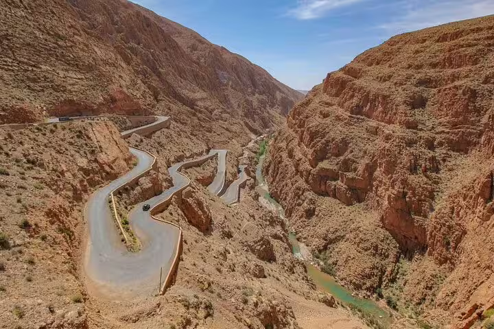Scenic switchback road through Dades Gorge with river canyon views on Morocco 9-day tour from Marrakech