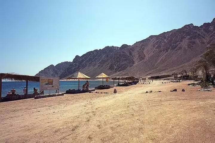 Dahab beach and mountains on day trip from Sharm el Sheikh, relaxing stop before ATV quad biking