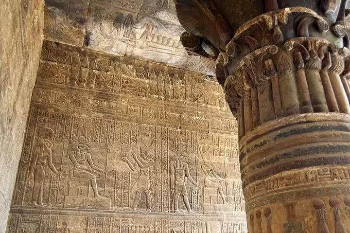 Carved hieroglyphs and column at an ancient Nile temple, seen on a 5-day Dahabiya cruise