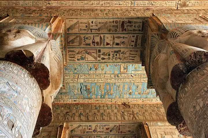 Painted hieroglyphic ceiling between temple columns, highlight of a 5-day Dahabiya Nile cruise
