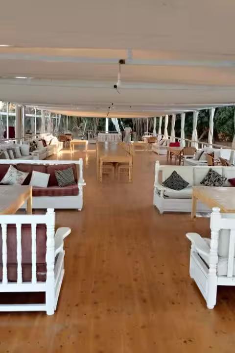 Dahabiya Nile cruise sun deck lounge with shaded seating, relaxing on 5 days 4 nights Egypt itinerary