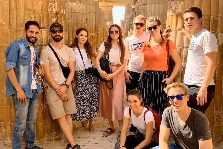 Tour group at Saqqara temple ruins on private Dahshur, Memphis and Saqqara all-inclusive day trip from Cairo