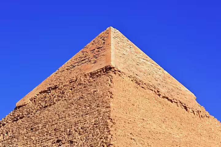 Close-up of Dahshur Red Pyramid limestone blocks under blue sky on Cairo luxury desert tour
