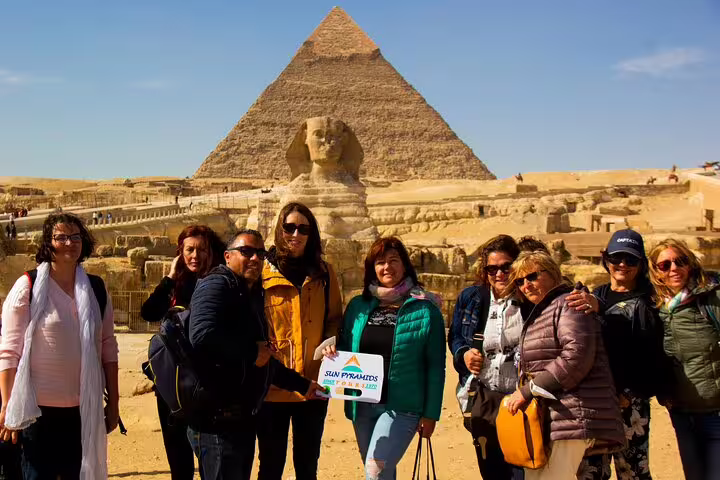 Tour group at Giza Pyramids and Sphinx, highlight of a day tour to Cairo from Alexandria port
