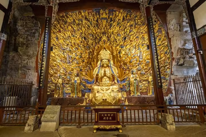 Golden Thousand-Hand Bodhisattva statue at Dazu Rock Carvings, a highlight of the Chongqing private charter tour.