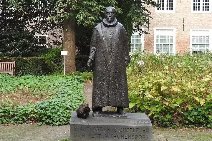 Statue in Delft garden stop on highlights walking tour with GPS and audio guide through historic center