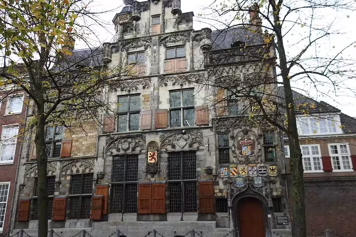 Historic Delft landmark facade on a highlights walking tour with audio guide and GPS navigation app