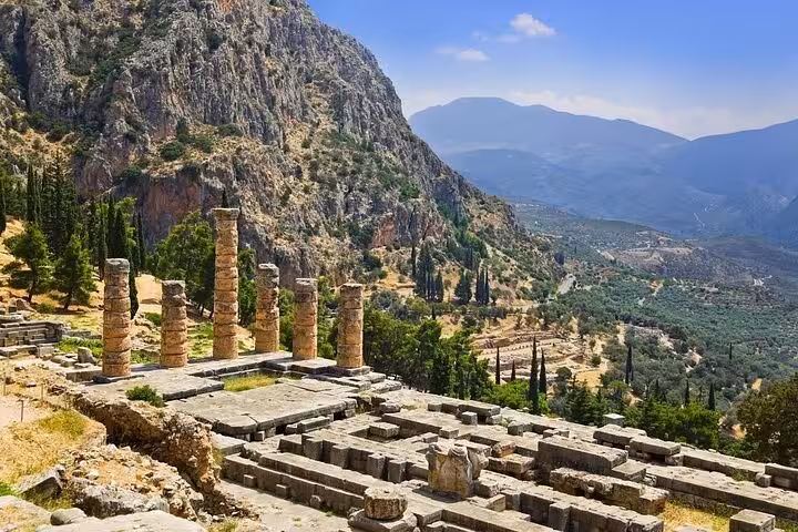 Delphi archaeological site terrace with ancient columns and mountain views on Thermopylae and Delphi day tour