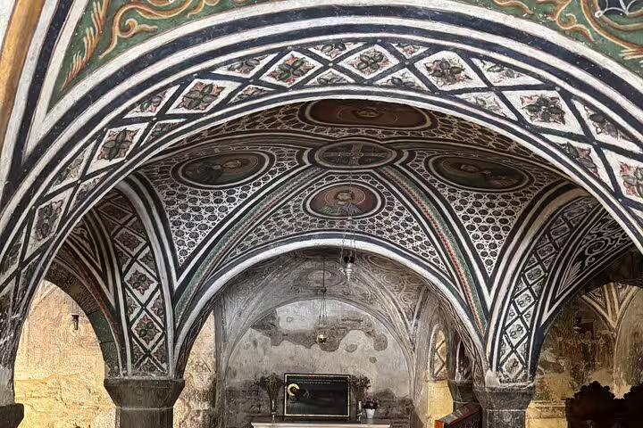 Frescoed Byzantine arches inside Hosios Loukas Monastery, cultural stop on Delphi full-day private Oracle tour