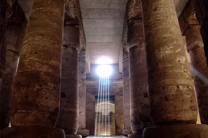 Sunbeams in the hypostyle hall at Dendera Temple, Egypt, on a Dendera and Medinet Habu day tour