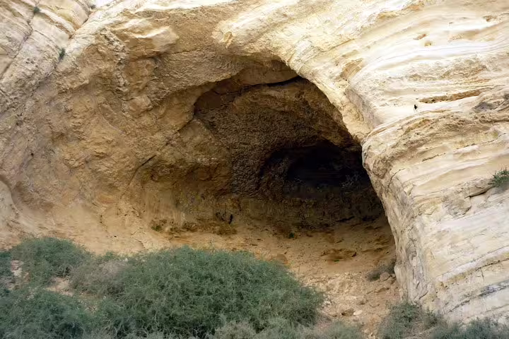 Desert cave in the Judean Desert near Masada, visited on a private Dead Sea and Masada day tour from Tel Aviv