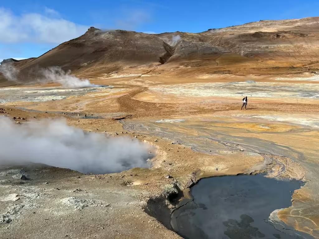 Steaming geothermal hot springs and mudpots in Iceland's Diamond Circle volcanic landscape near Akureyri
